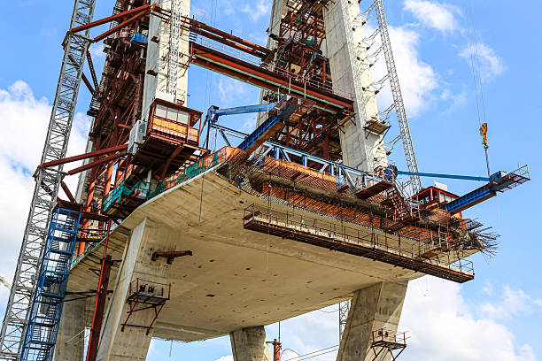 istock Construction of High-Rise Structural Framework of Cable Stayed Tower Bridge with Tower Cranes 2249453222