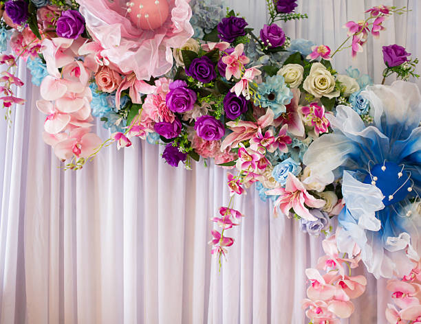 istock Colorful flowers decorated on a white curtain background. 2249453534