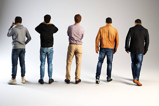 istock Five men from behind wearing various outfits indoors. 2249457067
