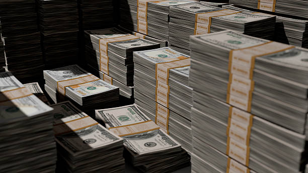 istock Stacks of one hundred dollar bills. 2249464576