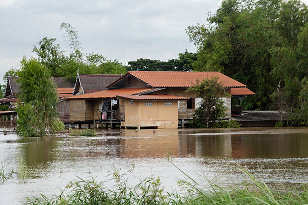 06,Sep,2025,Sena Ayutthaya, a storm and heavy rain caused water to overflow from the river and flood houses along the river called Mae Nam Noi in the rural area of Ayutthaya, Thailand.