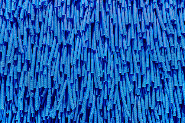 Skeins of blue corrugated pipe close up