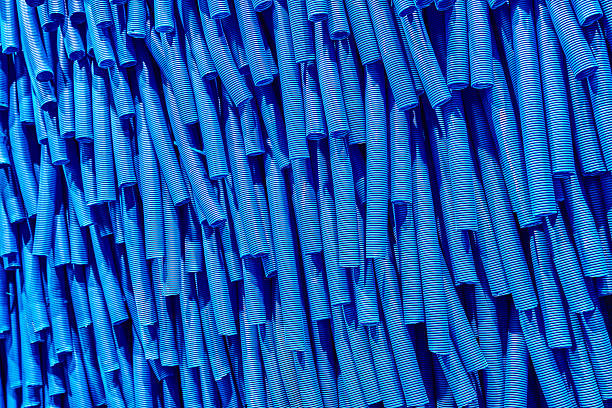 Skeins of blue corrugated pipe close up