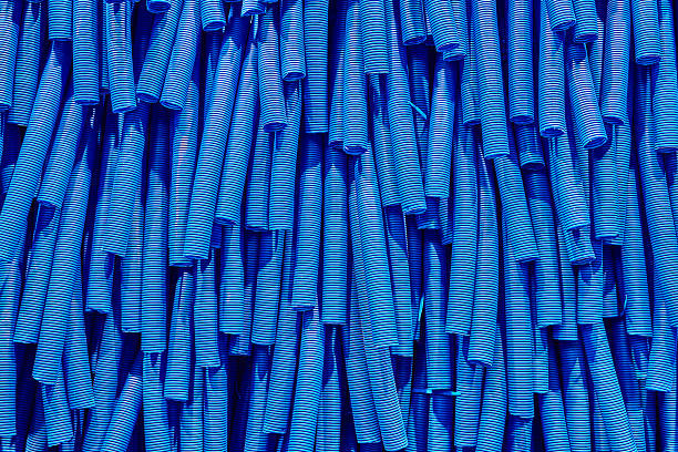 Skeins of blue corrugated pipe close up