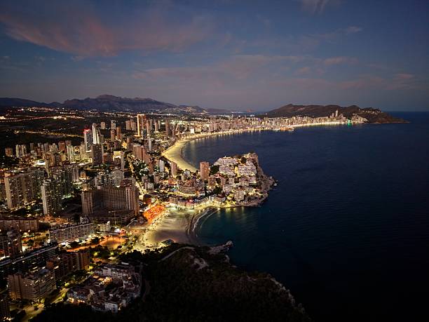 istock evening seaside city with glowing structures and shimmering water creating vibrant nightlife atmosphere 2249471392