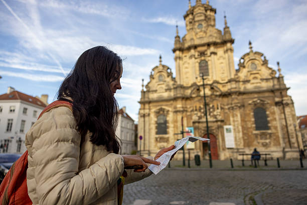 istock woman checking map in front of the historical building 2249473602