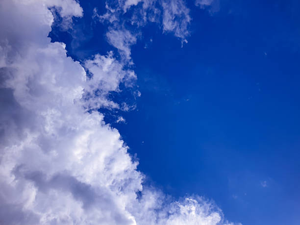 istock Large cloud mass meeting open blue sky, creating a contrasting atmosphere suitable for climate visuals, dreamy backgrounds, or broad outdoor environmental concepts. 2249476959