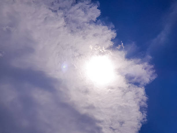 istock High contrast scene of strong sunlight shining through layered clouds, offering a powerful atmospheric mood perfect for climate concepts and dramatic sky compositions. 2249477350