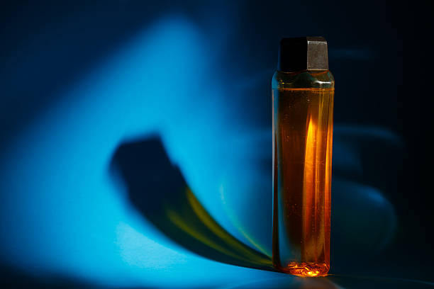 Incense of Traditional Arabian Fragrance Oudh Bakhoor in a maroon glass jar on light background
