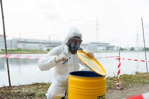 istock Ecologists in protective gear work to check the water conditions in a pond on a farm where aquatic animals are kept and collect water samples for analysis. 2249480498