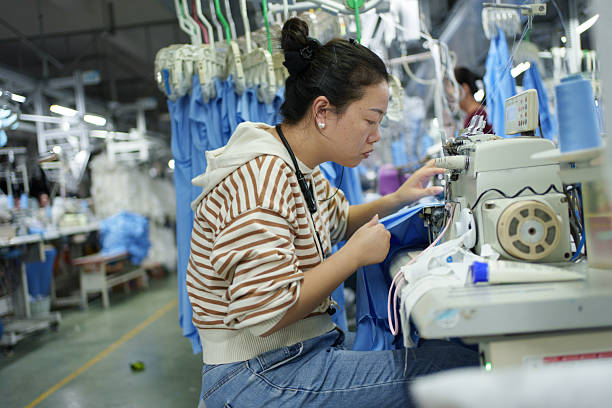 istock Sewing workers in a garment manufacturing factory 2249483505