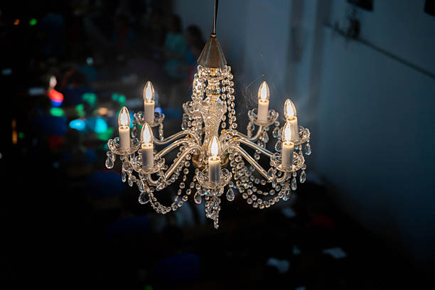 istock old black and white chandelier with cobwebs 2249484302