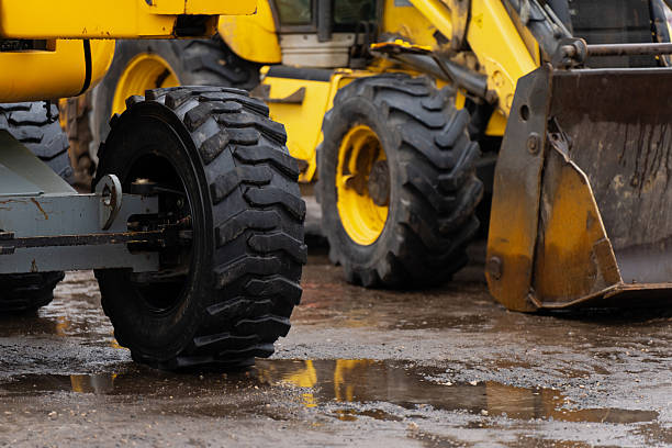 Public city street reconstruction with heavy machines.