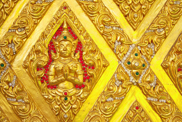 Mural sculptures inside the temple. Built with donations, no artists are named.