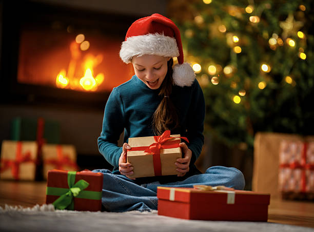istock girl with Christmas gift 2249490464