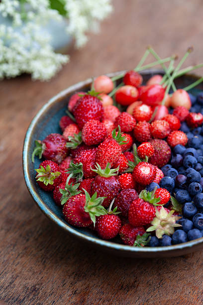 Wild garden berries -  alpine strawberry, bilberry, cherry.