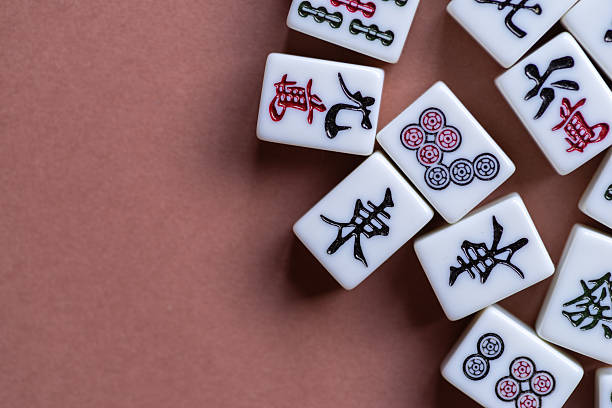 istock Mahjong tiles lined up on a light background 2249493759