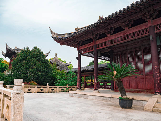 istock Traditional chinese architecture showcases serene courtyard and lush greenery in historic site during daytime 2249494476