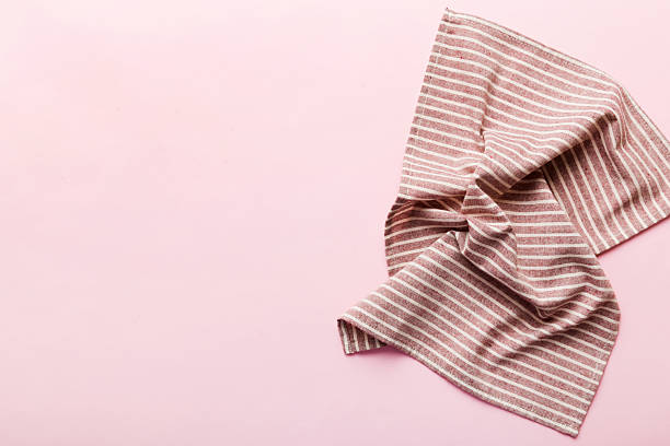 istock top view with red empty kitchen napkin isolated on table background. Folded cloth for mockup with copy space, Flat lay. Minimal style 2249495477
