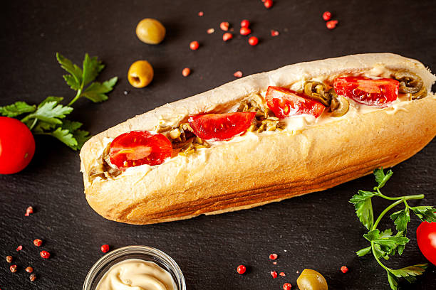 istock Baguette sandwich with tomatoes and olives 2249497280