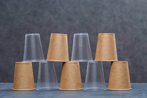 istock Eco-friendly disposable tableware made of bamboo wood and paper on a gray background. Plastic dishes and cutlery. Caring for the environment. Recycling problem. safe planet, environmental concept. 2249497590
