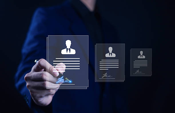 istock A business professional selecting a digital resume interface with glowing signature, representing recruitment, HR technology, candidate evaluation, online hiring process, modern workforce management. 2249499020