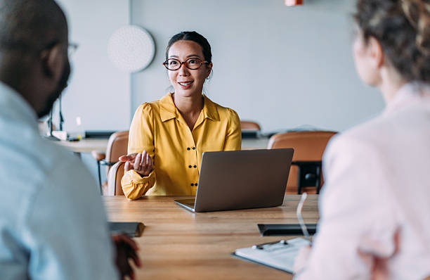 istock Group of business persons talking in the office. 2249499770