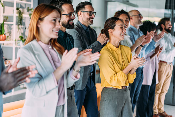 istock Businesspeople applauding during a seminar in conference hall. 2249499796
