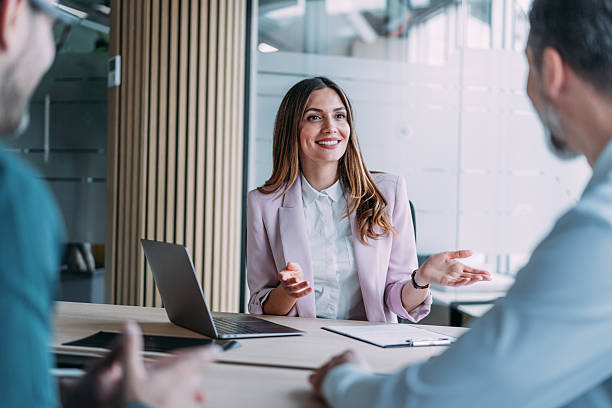 istock Group of business persons talking in the office. 2249500290