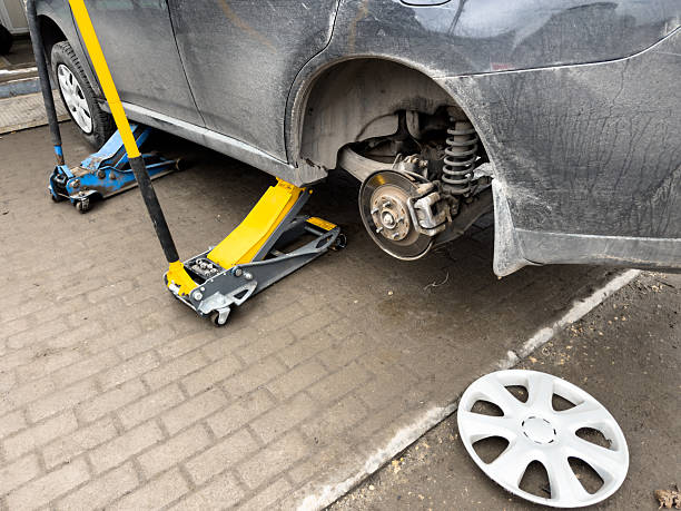 istock A car is being lifted by a car jack 2249500631