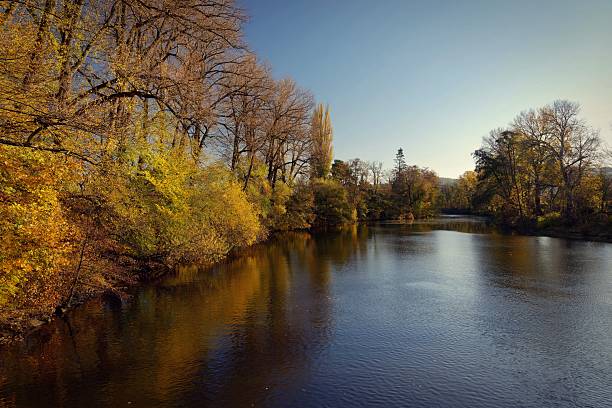 istock Autumn landscape with river and setting sun. Concept for nature and autumn time 2249500779