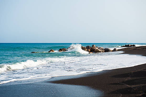 istock Santorini island, Greece. Perissa beach with black volcanic sand. 2249502113