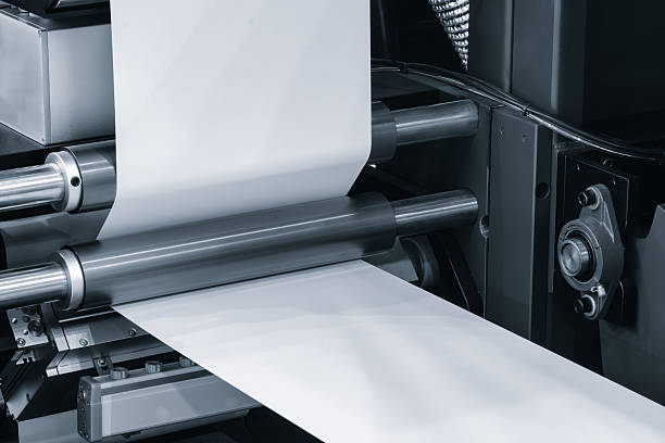 istock Automatic industrial machine for producing polyethylene bags or packaging products in plastic film. Automatic packaging products and food products concept 2249502185