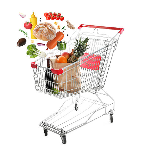 istock Groceries falling into shopping cart on white background 2249502220