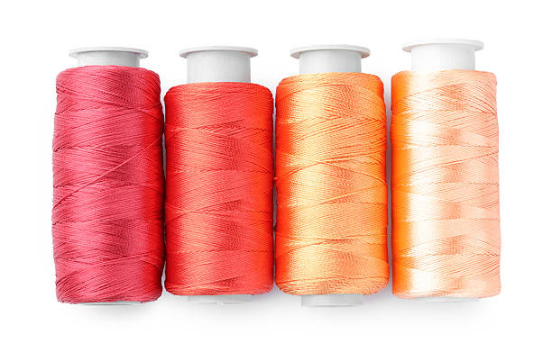 istock Spools of colorful sewing threads isolated on white, top view 2249502862