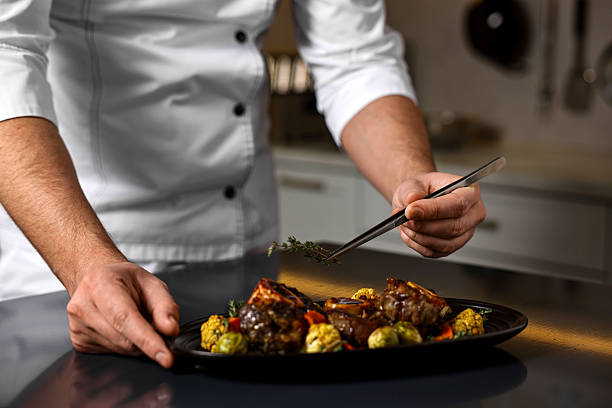 istock Professional chef serving dish at table indoors, closeup 2249506055