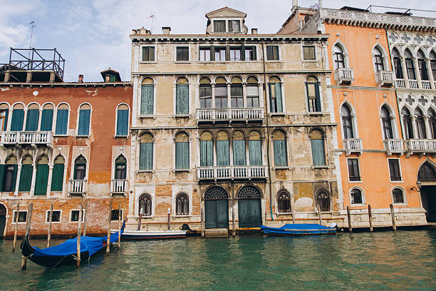istock Venetian canal with historic buildings and gondolas 2249507033