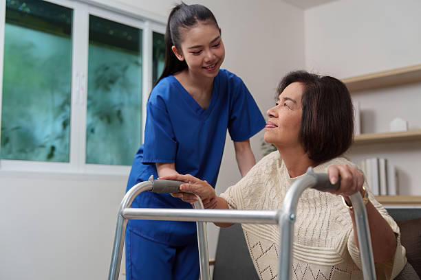 istock Caregiver encouraging elderly woman during mobility training 2249508655