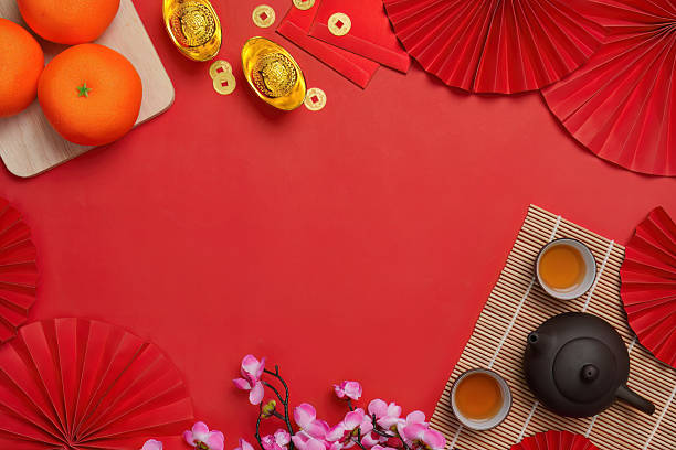 istock Chinese New Year background with oranges and tea set, top view 2249509666