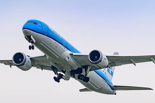 KLM Boeing 787 Dreamliner airplane taking off from Schiphol airport on the Kaagbaan. KLM stands for Koninklijke Luchtvaart Maatschappij, Royal Dutch Airlines and is part of Air France–KLM. The Boeing 787 alos called Dreamliner is a wide-body jet airliner by American manufacturer Boeing Commercial Airplanes. Schiphol is one of the busiest and largest airports in Europe, located near Amsterdam, Netherlands. It serves as a major hub for international flights and is a key gateway to Europe.