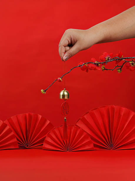 istock Chinese New Year celebration with red decorations and a golden bell 2249513348