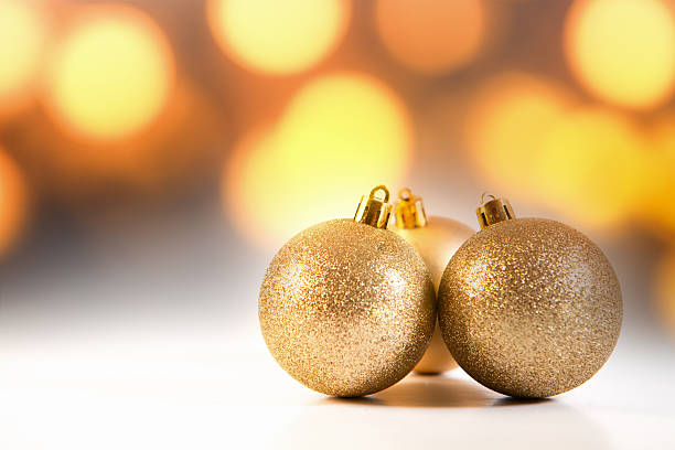 istock golden christmas ball and blurred background 2249513421