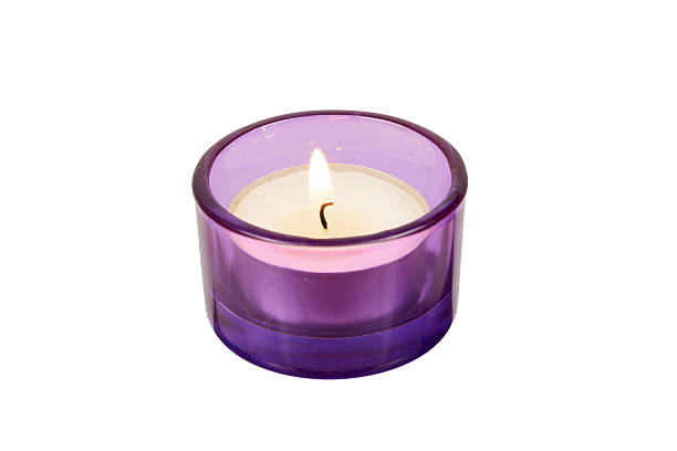 istock purple candle or tealight isolated on white 2249517024
