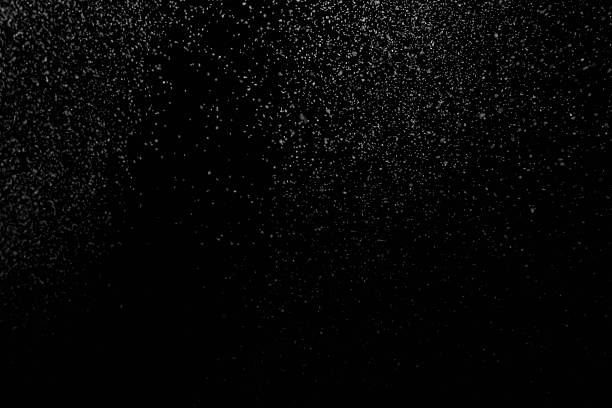 istock The falling white snow on a black background 2249517311