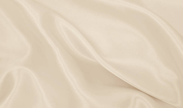 istock Smooth elegant golden silk or satin luxury cloth texture as wedding background. Luxurious background design. In Sepia toned. Retro style 2249520344