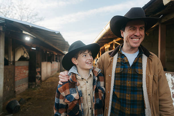 Photo of a young boy and his dad at the horse ranch