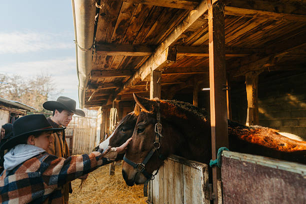 Photo of a young boy and his dad at the horse ranch