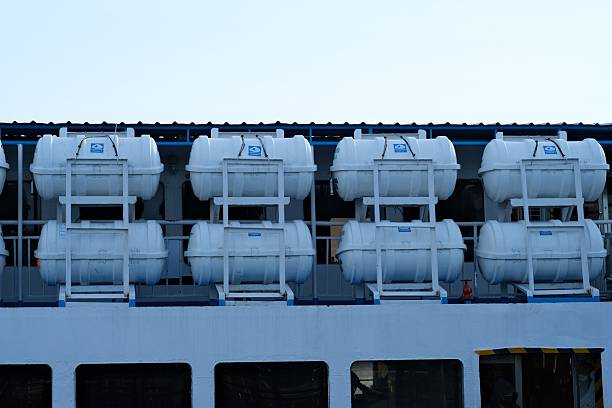 istock White Lifeboat Capsules Mounted on Passenger Ship 2249521011