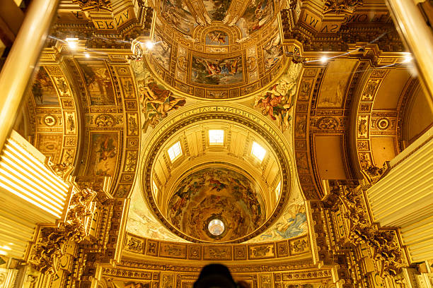 Rom â Lazio â Italy â 08-21-2025: Interior dome of Basilica of SantAndrea in Rome, called SantAndrea, shows ornate baroque architecture and religious ceiling frescoes.