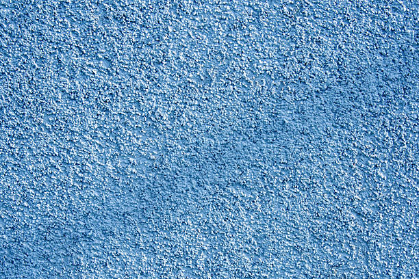 istock Close-up of blue plaster texture with a dark stripe in the middle 2249524690